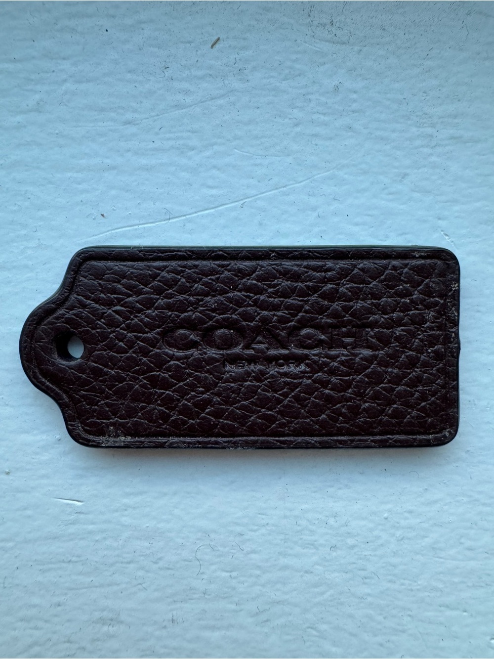 Coach Dark Brown Pebbled Leather Bag Tag